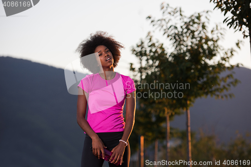 Image of Portrait of a young african american woman running outdoors