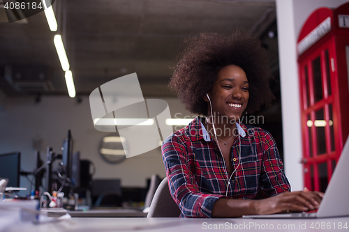 Image of portrait of a young successful African-American woman in modern 