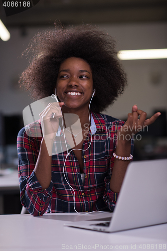 Image of portrait of a young successful African-American woman in modern 