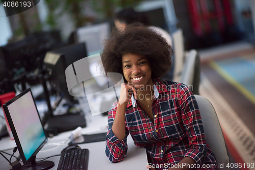 Image of portrait of a young African American woman in modern office