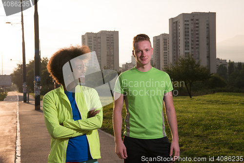 Image of Portrait of romantic pretty couple on fitness session, outside t