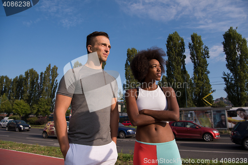 Image of Portrait of romantic pretty couple on fitness session, outside t