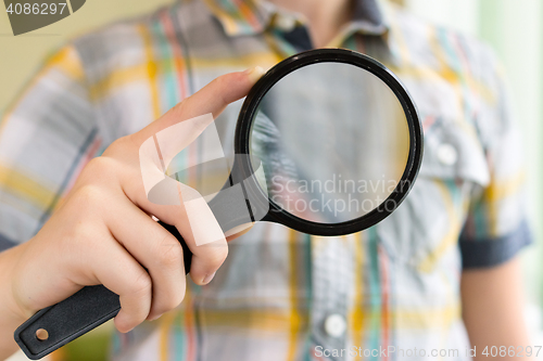 Image of Brainy lad with magnifying glass