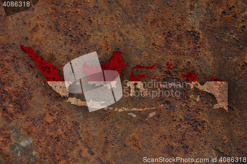 Image of Map and flag of Indonesia on rusty metal