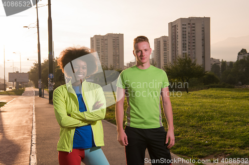 Image of Portrait of romantic pretty couple on fitness session, outside t