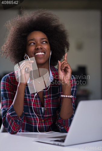 Image of portrait of a young successful African-American woman in modern 