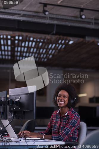 Image of portrait of a young successful African-American woman in modern 