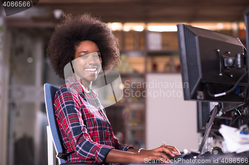 Image of portrait of a young successful African-American woman in modern 