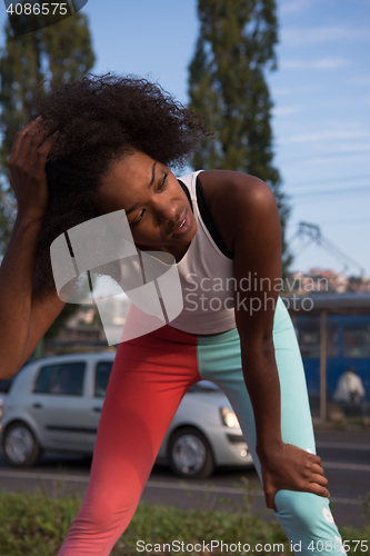 Image of Portrait of sporty young african american woman running outdoors