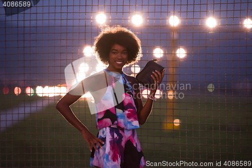 Image of portrait of a young African-American woman in a summer dress