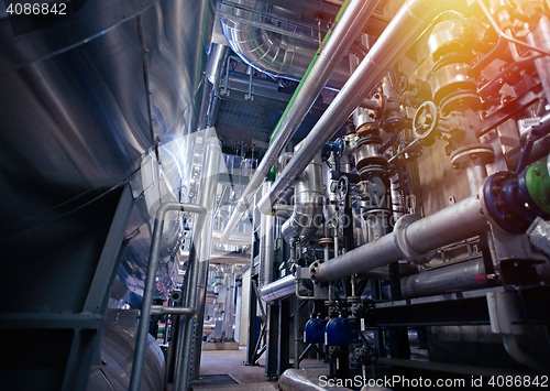 Image of Equipment, cables and piping as found inside of a modern industr