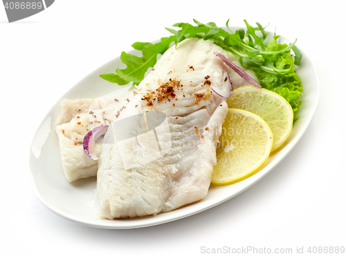 Image of roasted perch fish fillets on white plate