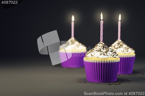 Image of delicious cupcakes with a burning candles