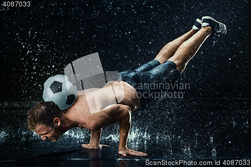 Image of Water drops around football player