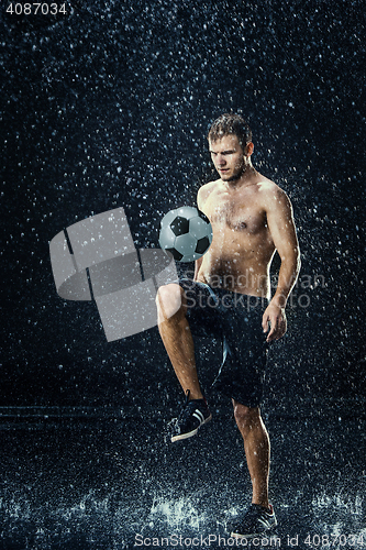 Image of Water drops around football player