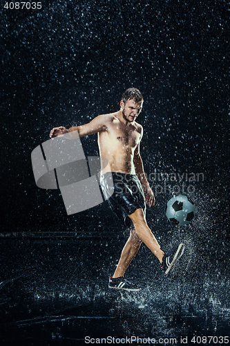 Image of Water drops around football player