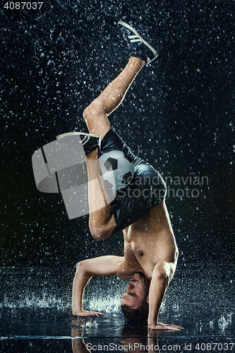 Image of Water drops around football player