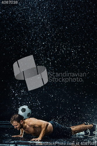 Image of Water drops around football player