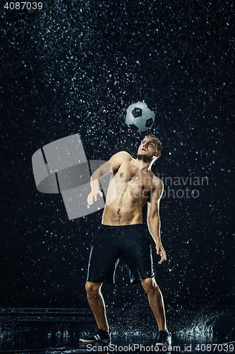 Image of Water drops around football player