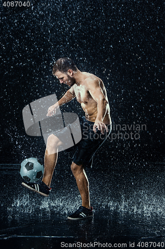 Image of Water drops around football player