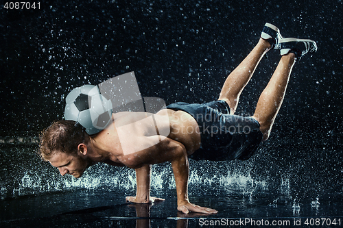 Image of Water drops around football player