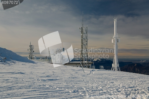 Image of Transmitter towers on a hill in winter