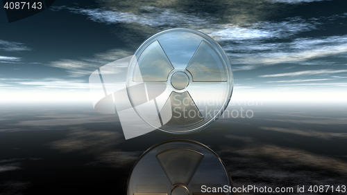 Image of nuclear symbol under cloudy sky - 3d illustration