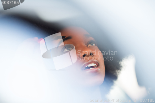 Image of woman making makeup while driving car