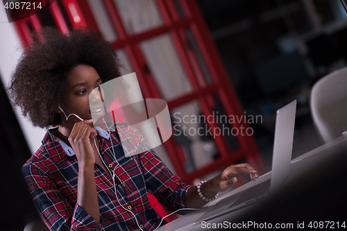 Image of portrait of a young successful African-American woman in modern 