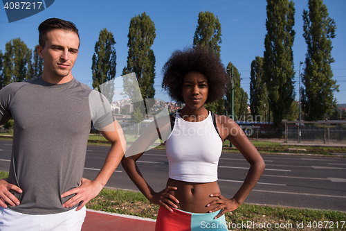 Image of Portrait of romantic pretty couple on fitness session, outside t