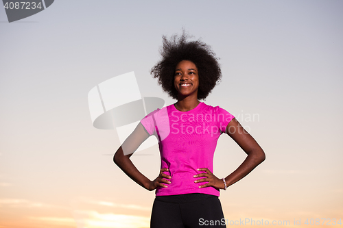 Image of Portrait of a young african american woman running outdoors