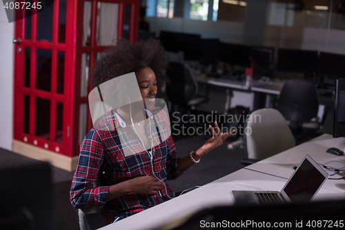 Image of portrait of a young successful African-American woman in modern 