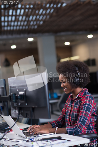 Image of portrait of a young successful African-American woman in modern 