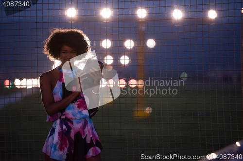 Image of portrait of a young African-American woman in a summer dress