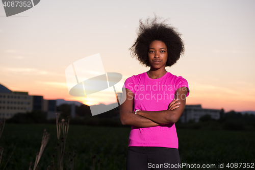 Image of Portrait of a young african american woman running outdoors