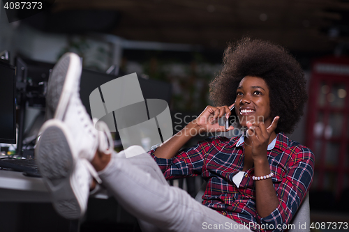 Image of portrait of a young successful African-American woman in modern 