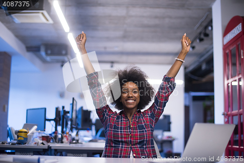 Image of portrait of a young successful African-American woman in modern 