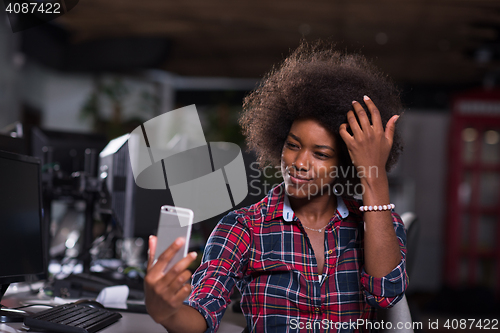 Image of portrait of a young successful African-American woman in modern 