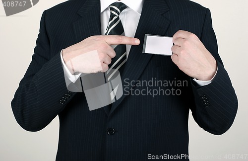 Image of Salesman pointing out his nametag