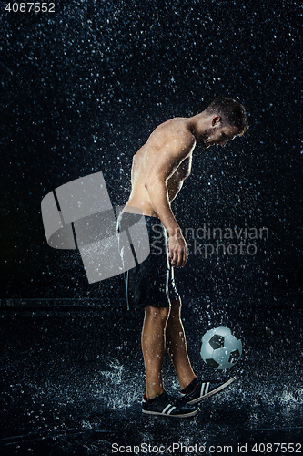 Image of Water drops around football player