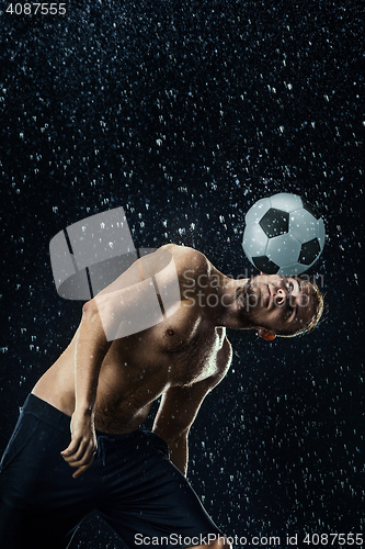 Image of Water drops around football player