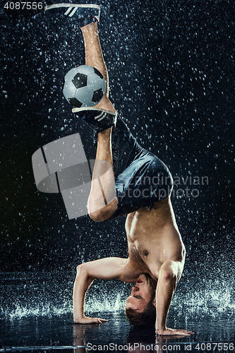 Image of Water drops around football player