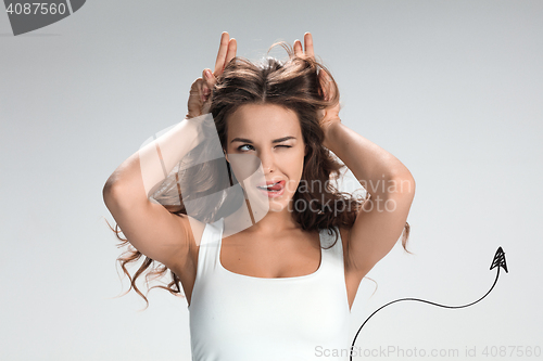Image of The young woman\'s portrait with funny emotions