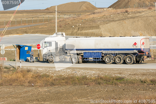 Image of Taman, Russia - November 5, 2016: Verification of documents from the driver tank truck at security checkpoint protected area