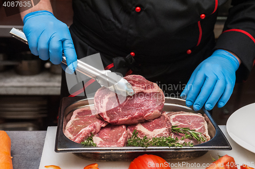 Image of Chef cutting meat