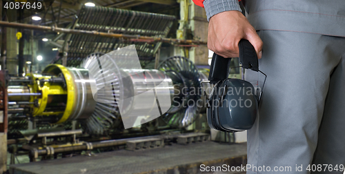 Image of Worker with protective headphone