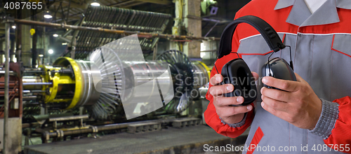 Image of Worker with protective headphone