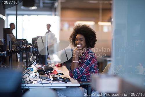 Image of portrait of a young successful African-American woman in modern 