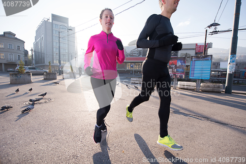 Image of young  couple jogging