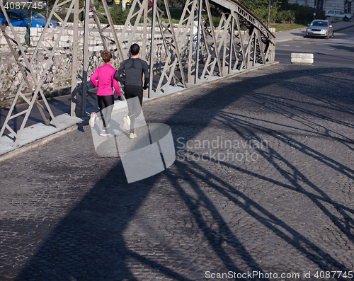 Image of young  couple jogging